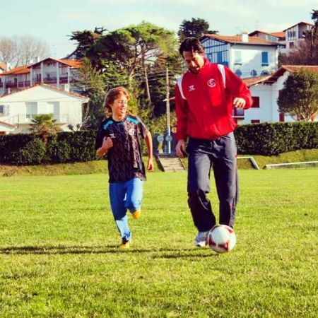Lander Emery Fernandez and his father playing football.
